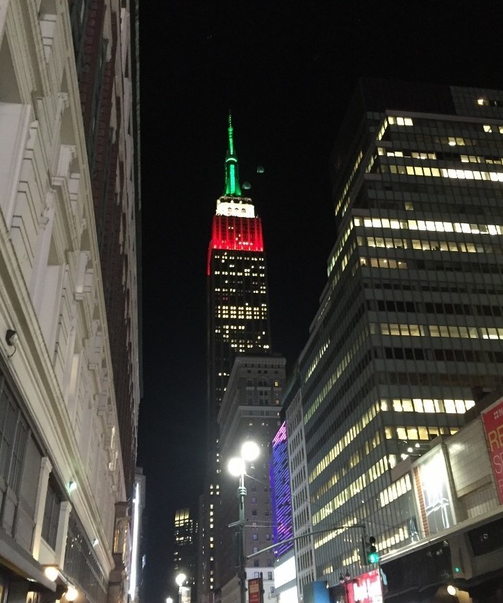 The lit up Empire state building